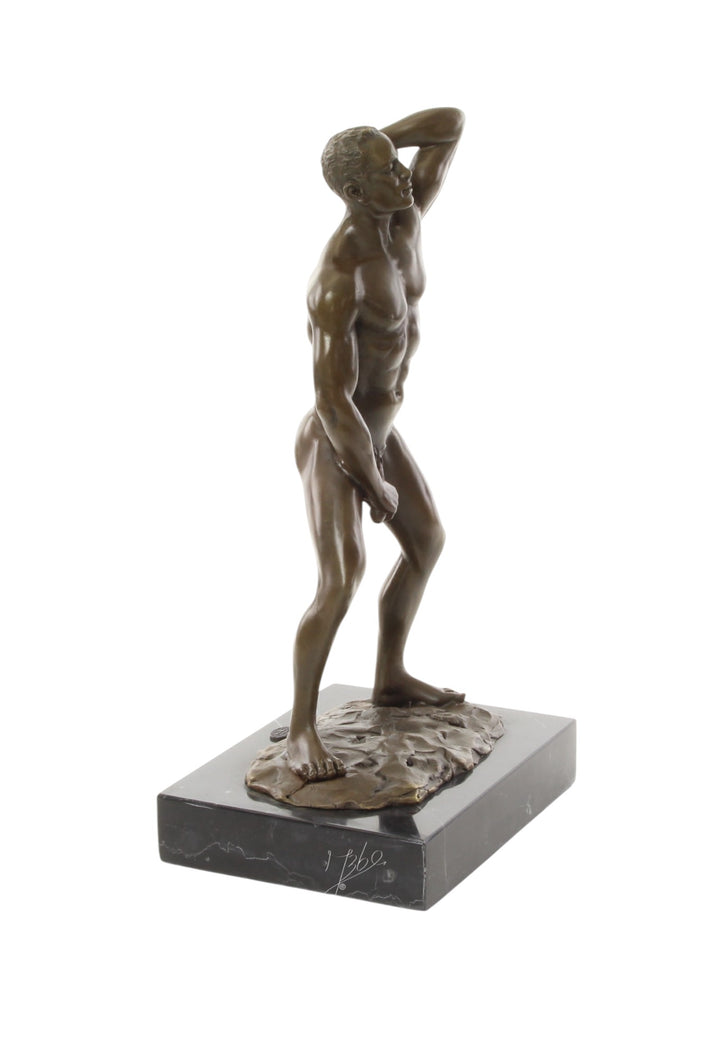 Bronze sculpture of a posing mascular male holding his phallus