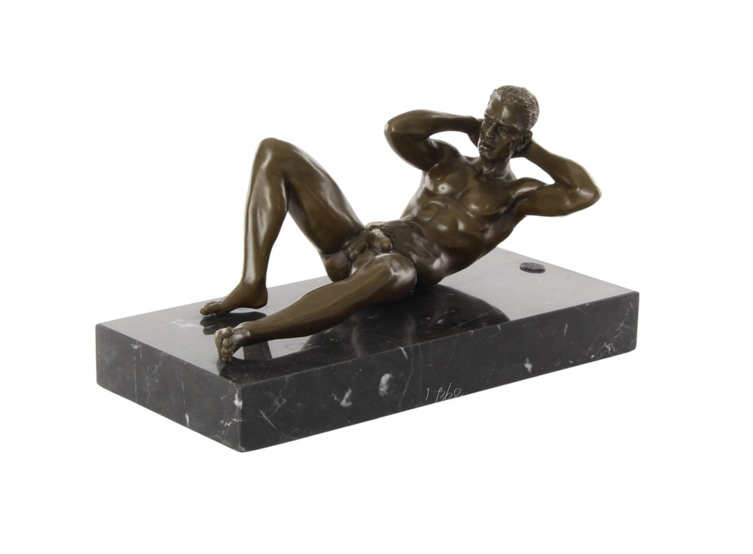 Bronze sculpture of a reclining male nude posing