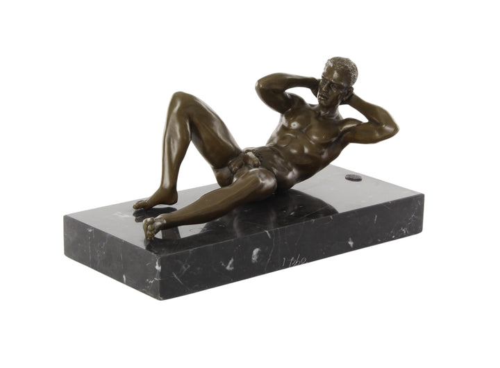 Bronze sculpture of a reclining male nude posing