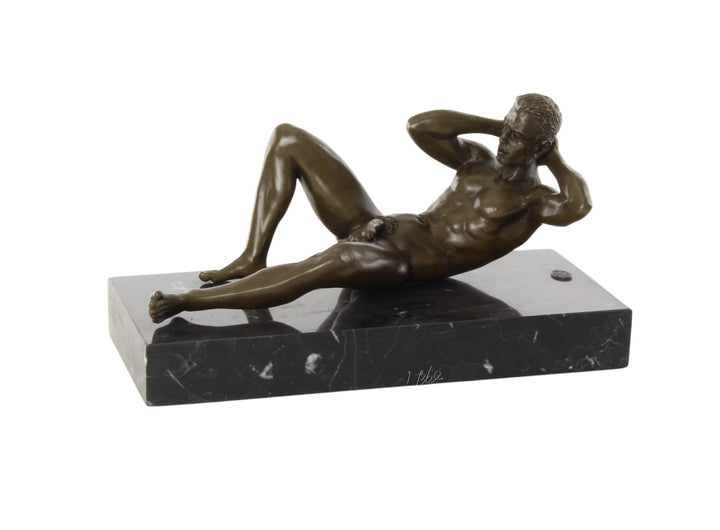 Bronze sculpture of a reclining male nude posing
