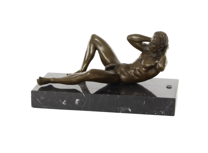 Bronze sculpture of a reclining male nude posing