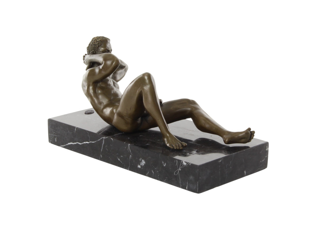 Bronze sculpture of a reclining male nude posing