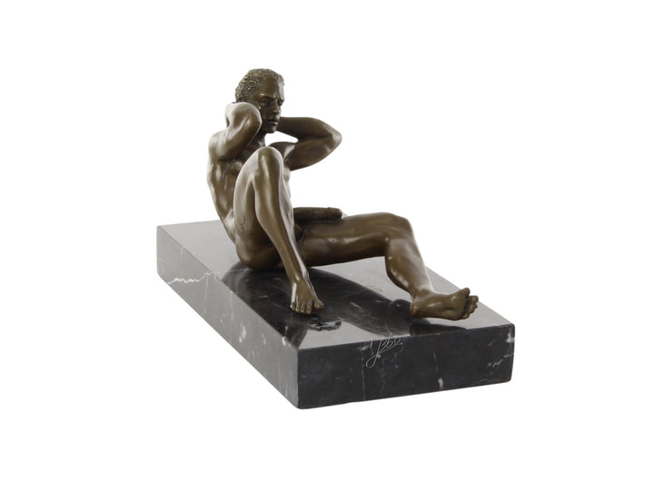 Bronze sculpture of a reclining male nude posing