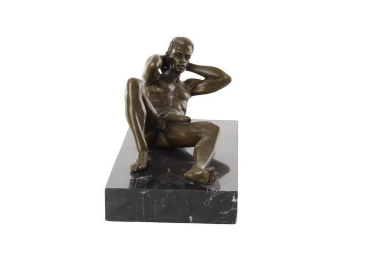 Bronze sculpture of a reclining male nude posing