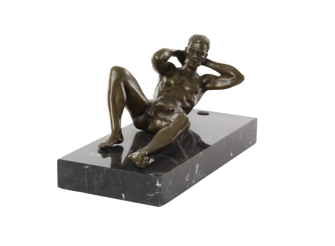 Bronze sculpture of a reclining male nude posing