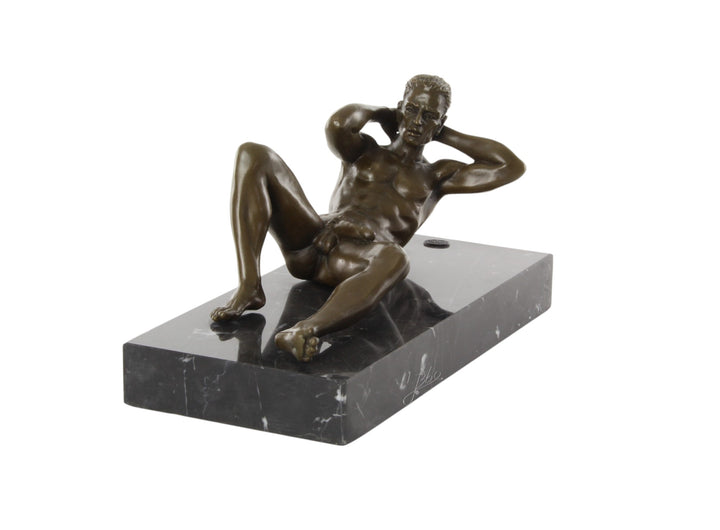 Bronze sculpture of a reclining male nude posing