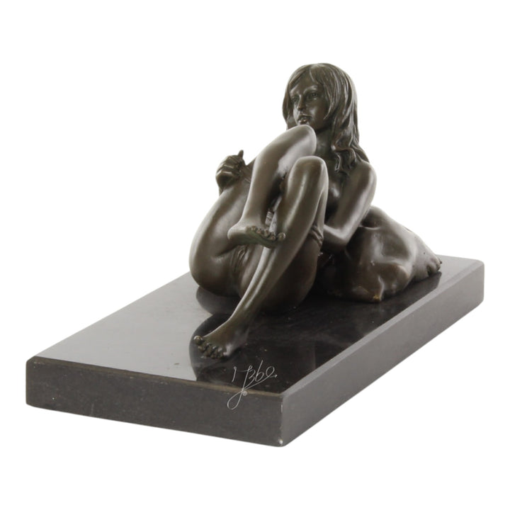 Bronze sculpture of a female nude taking off her panties