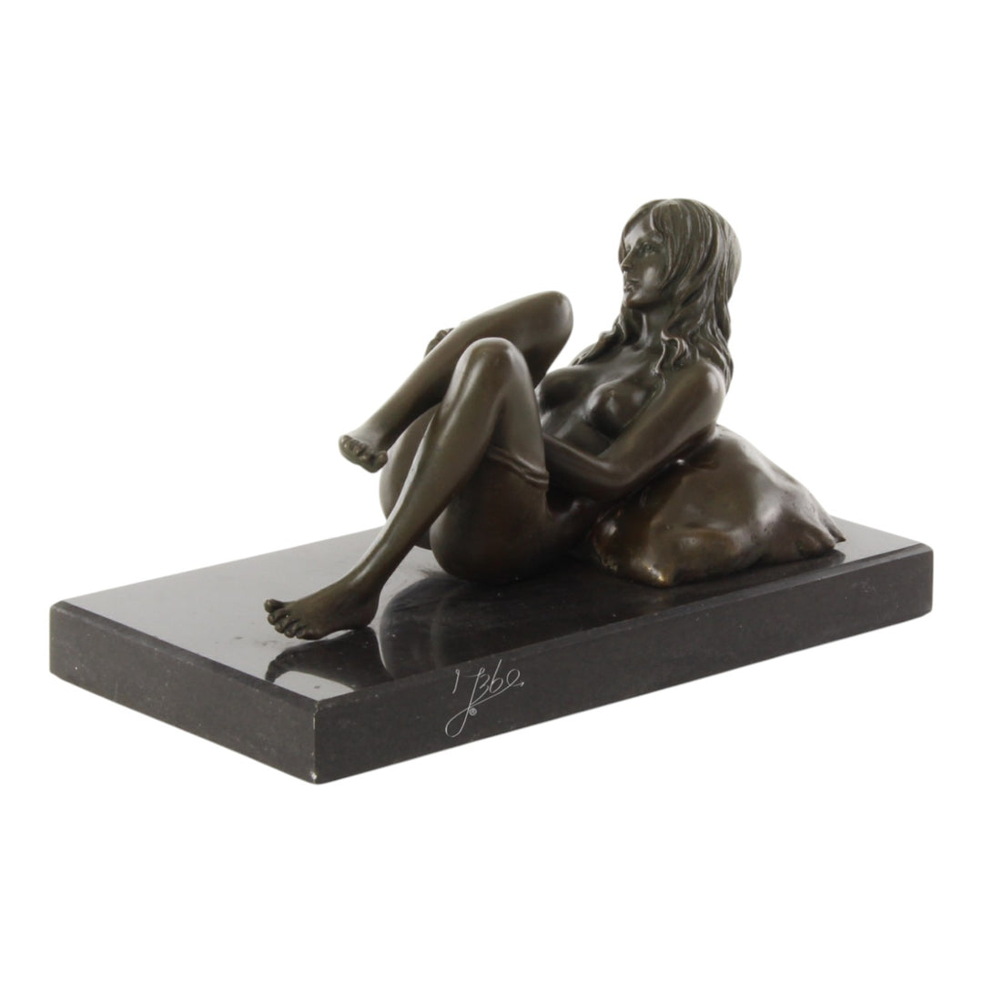 Bronze sculpture of a female nude taking off her panties