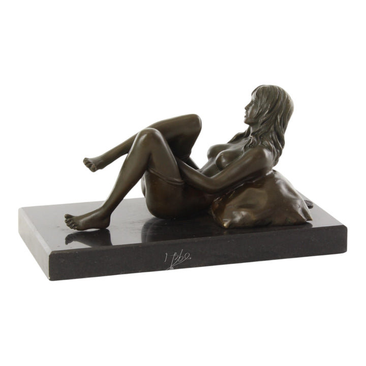 Bronze sculpture of a female nude taking off her panties