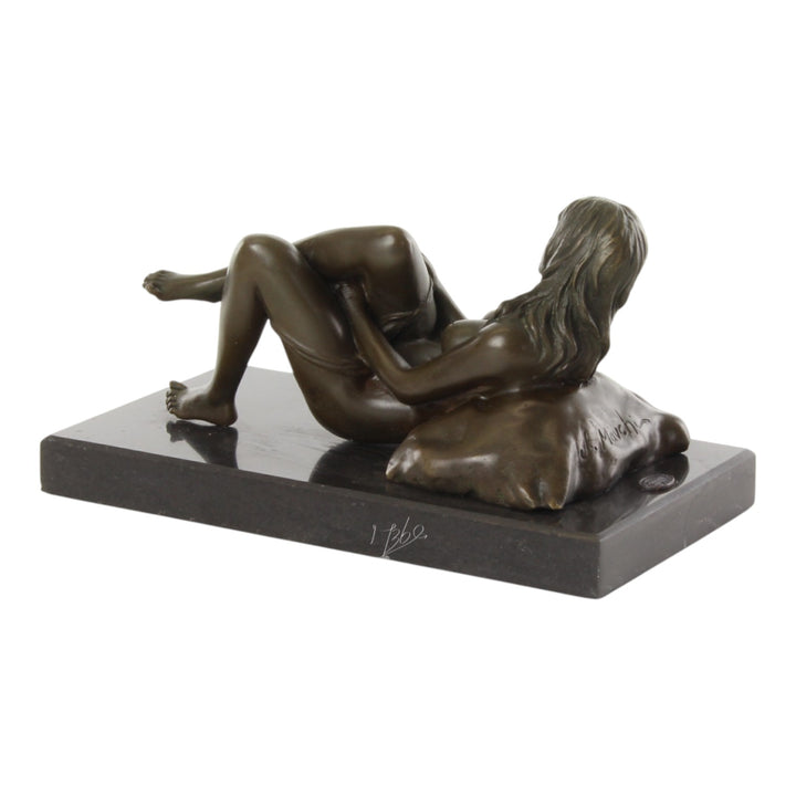 Bronze sculpture of a female nude taking off her panties