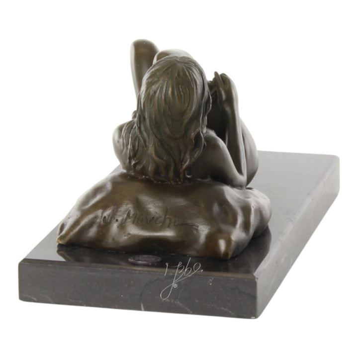 Bronze sculpture of a female nude taking off her panties