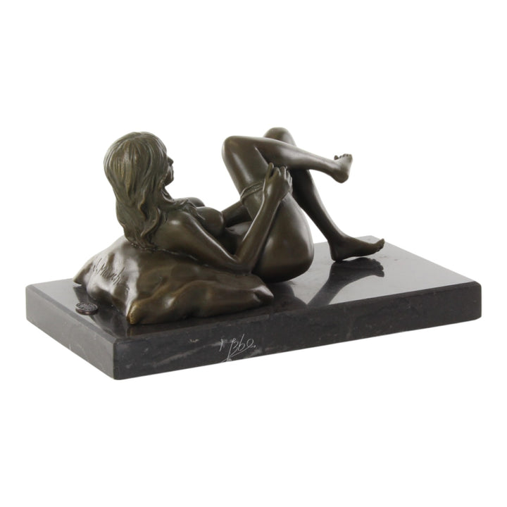 Bronze sculpture of a female nude taking off her panties