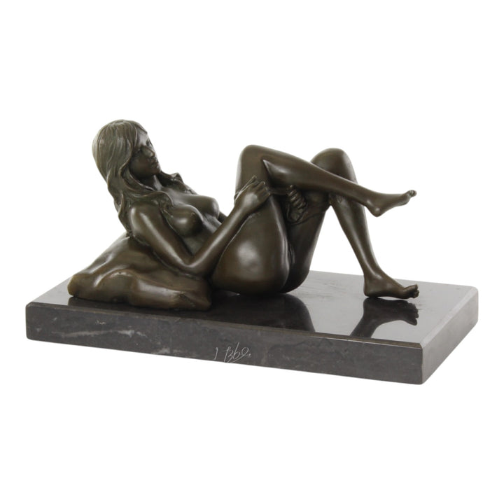Bronze sculpture of a female nude taking off her panties