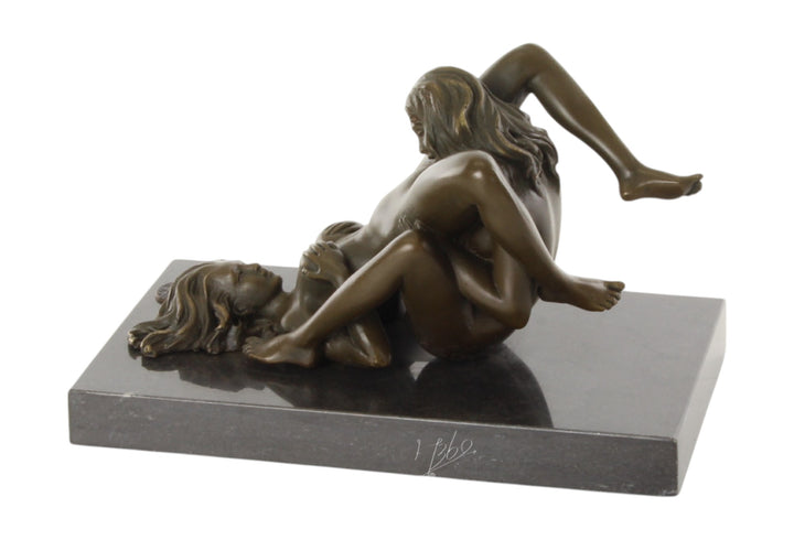 Bronze sculpture of a lesbian couple performing oral