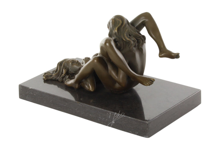 Bronze sculpture of a lesbian couple performing oral