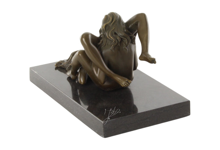 Bronze sculpture of a lesbian couple performing oral