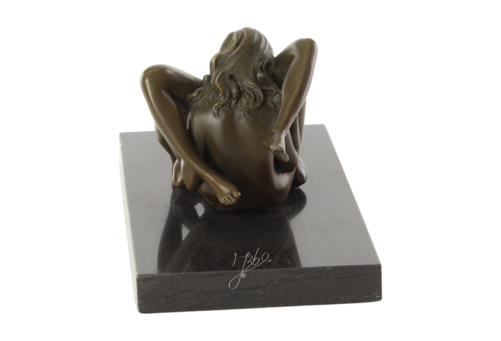 Bronze sculpture of a lesbian couple performing oral