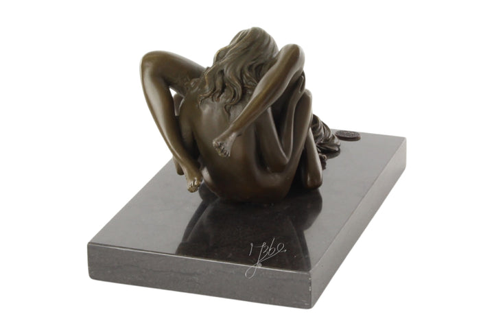 Bronze sculpture of a lesbian couple performing oral
