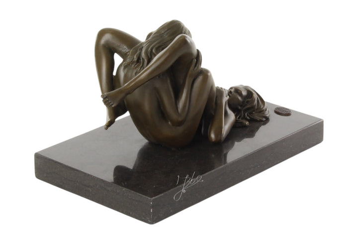 Bronze sculpture of a lesbian couple performing oral