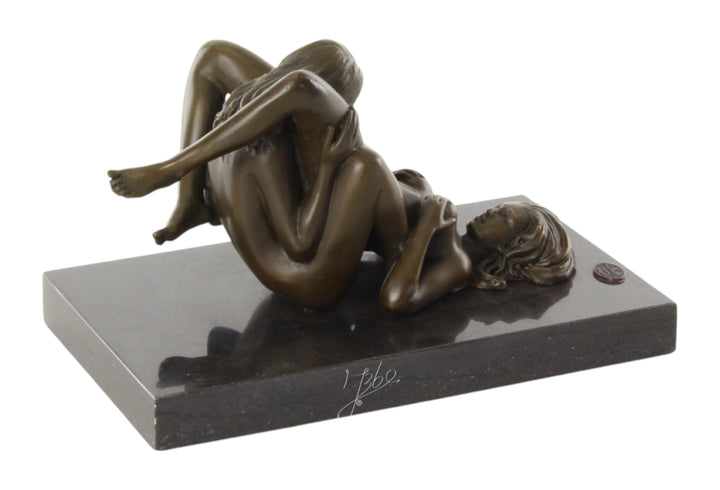 Bronze sculpture of a lesbian couple performing oral