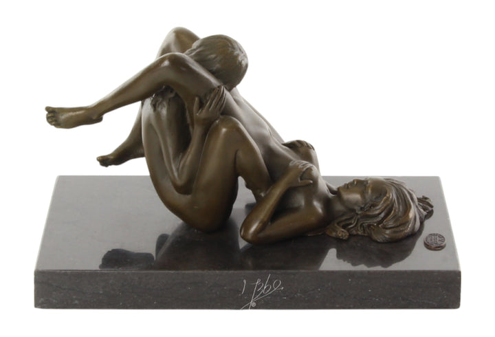 Bronze sculpture of a lesbian couple performing oral