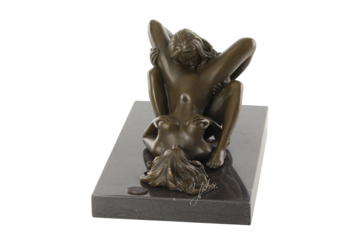 Bronze sculpture of a lesbian couple performing oral