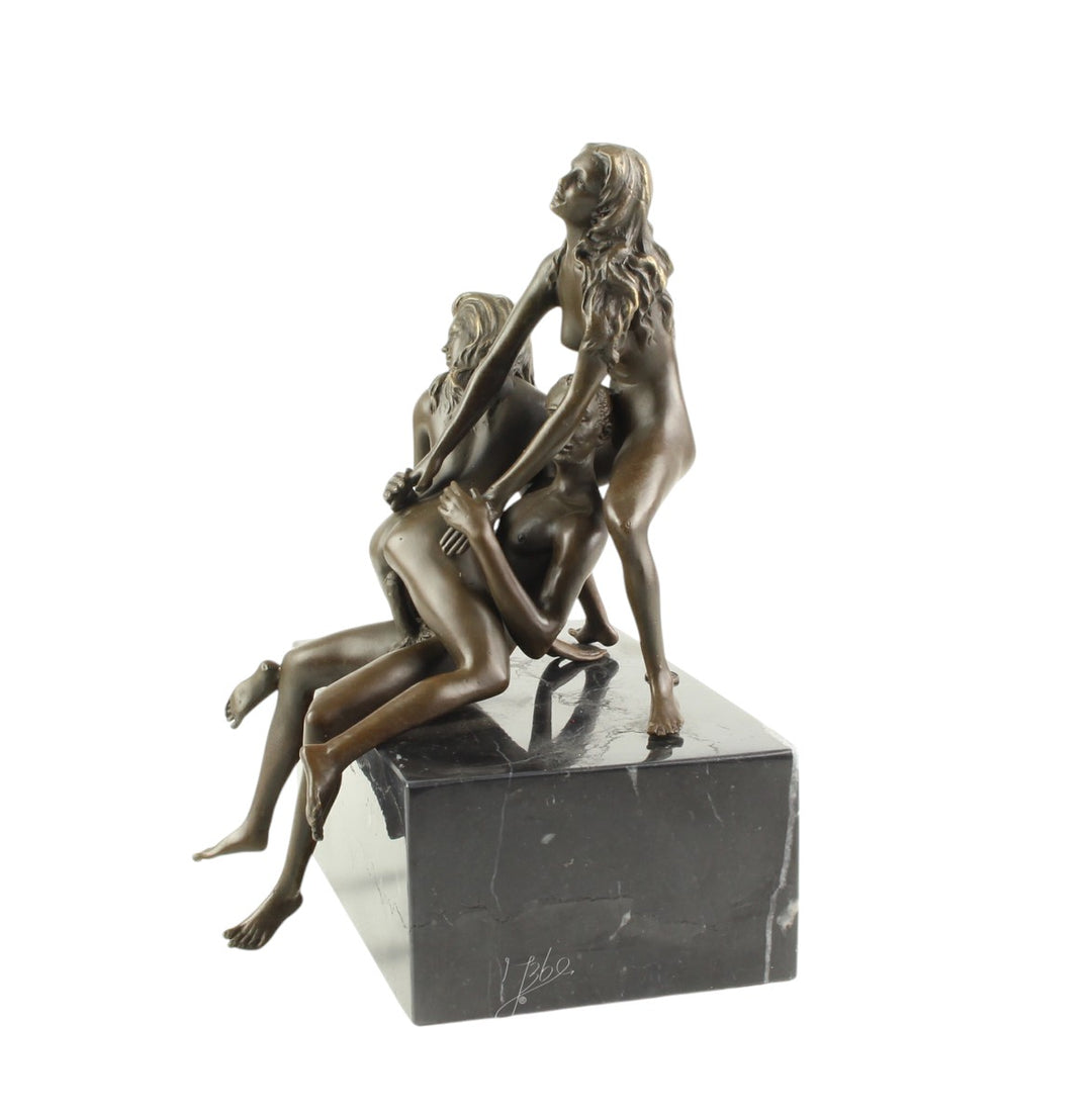 Bronze sculpture of a trio lovemaking scene