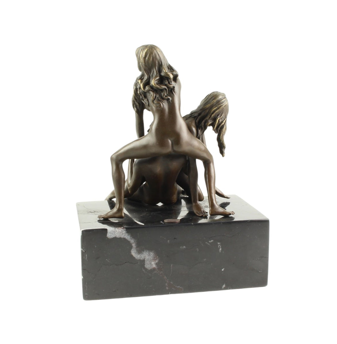 Bronze sculpture of a trio lovemaking scene