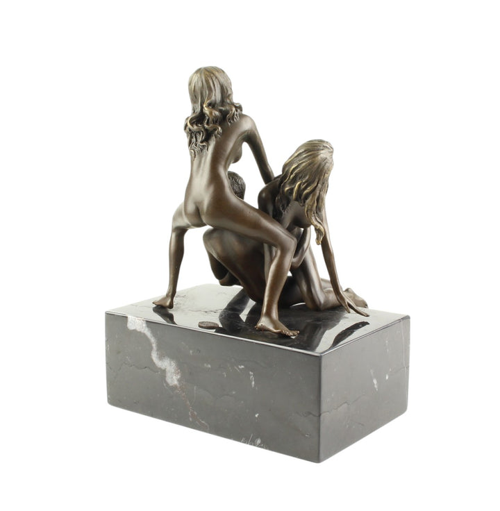 Bronze sculpture of a trio lovemaking scene