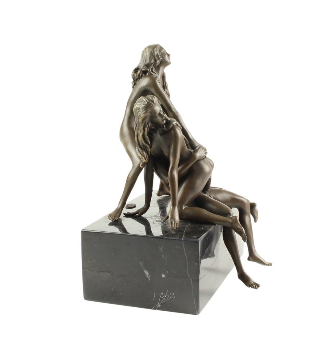 Bronze sculpture of a trio lovemaking scene