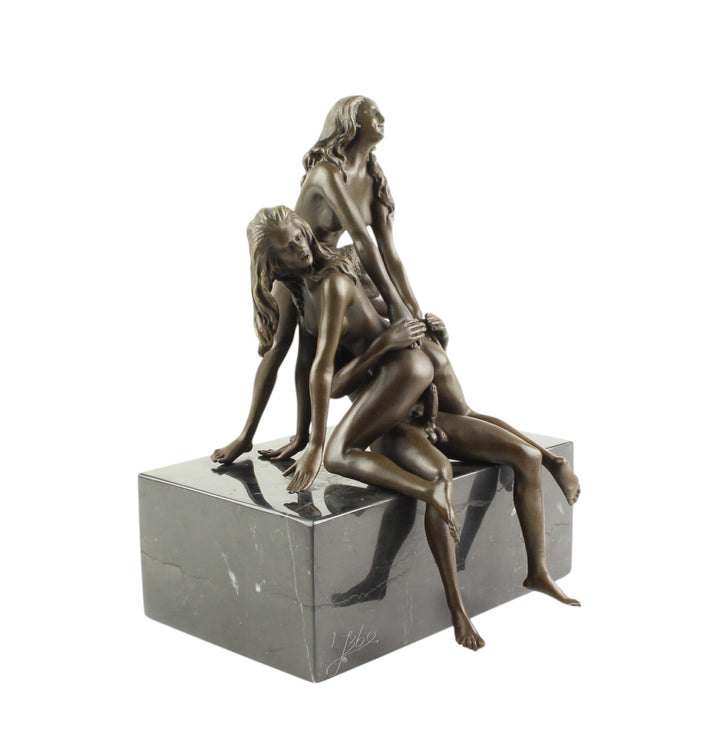 Bronze sculpture of a trio lovemaking scene