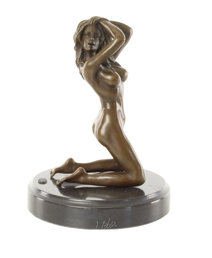 Erotic bronze sculpture of a female nude posing on her knees