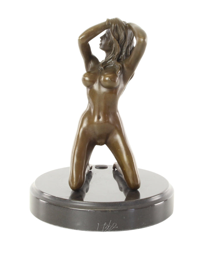 Erotic bronze sculpture of a female nude posing on her knees