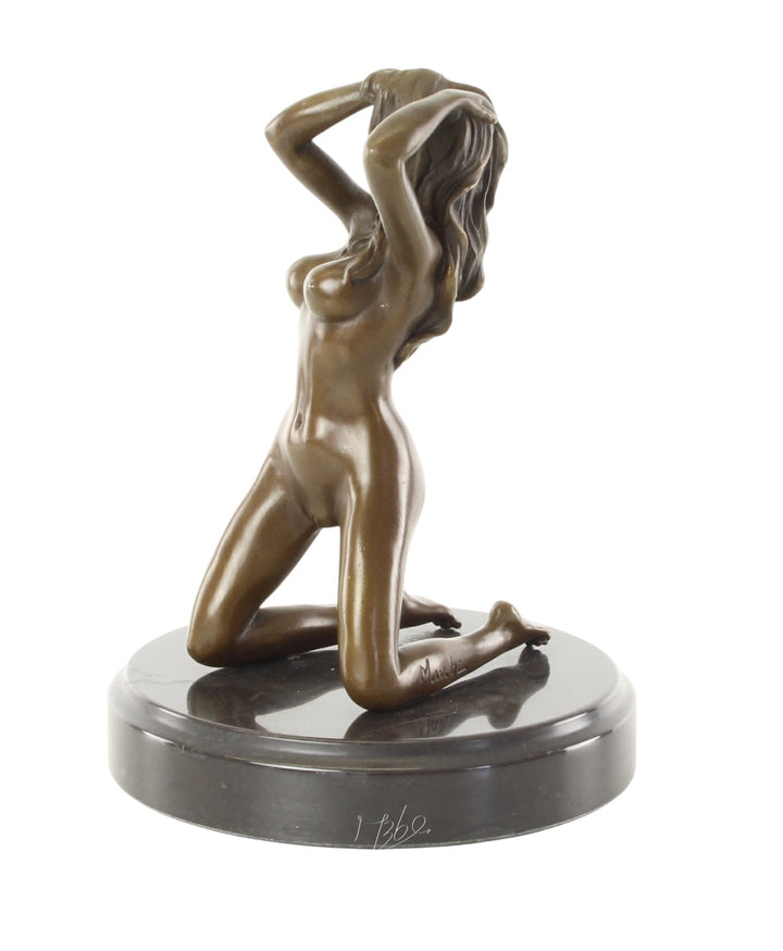 Erotic bronze sculpture of a female nude posing on her knees
