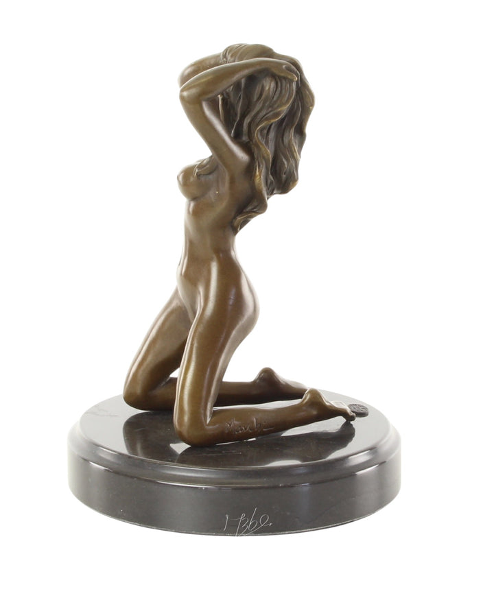 Erotic bronze sculpture of a female nude posing on her knees