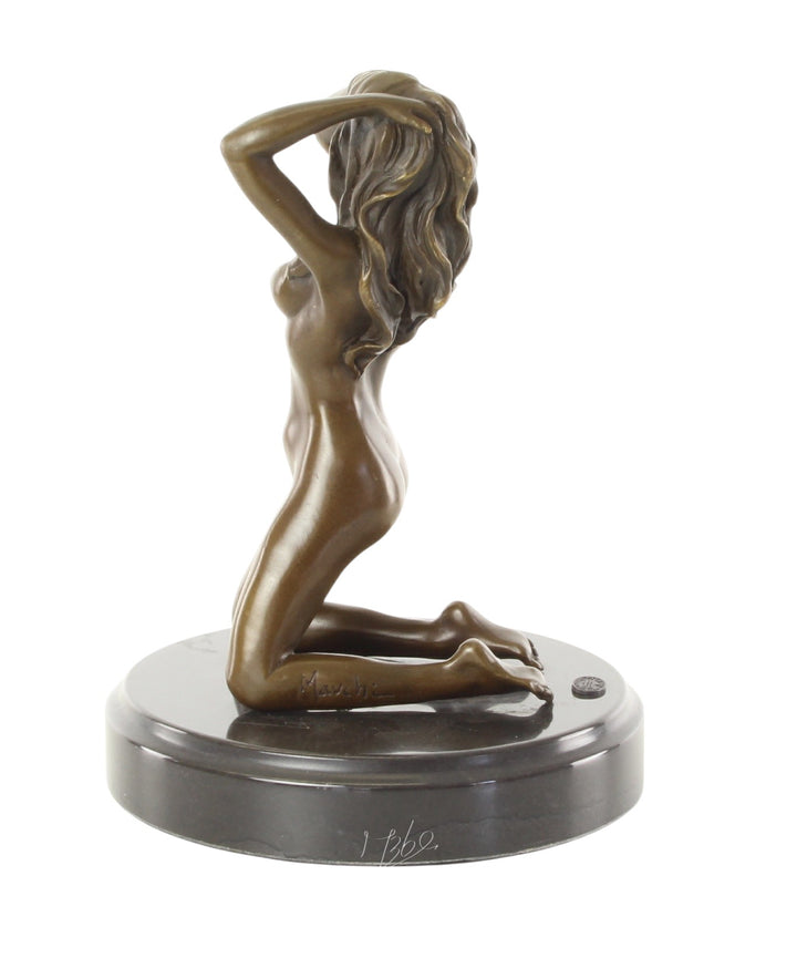 Erotic bronze sculpture of a female nude posing on her knees