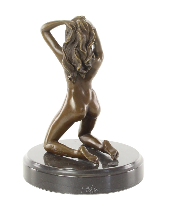 Erotic bronze sculpture of a female nude posing on her knees