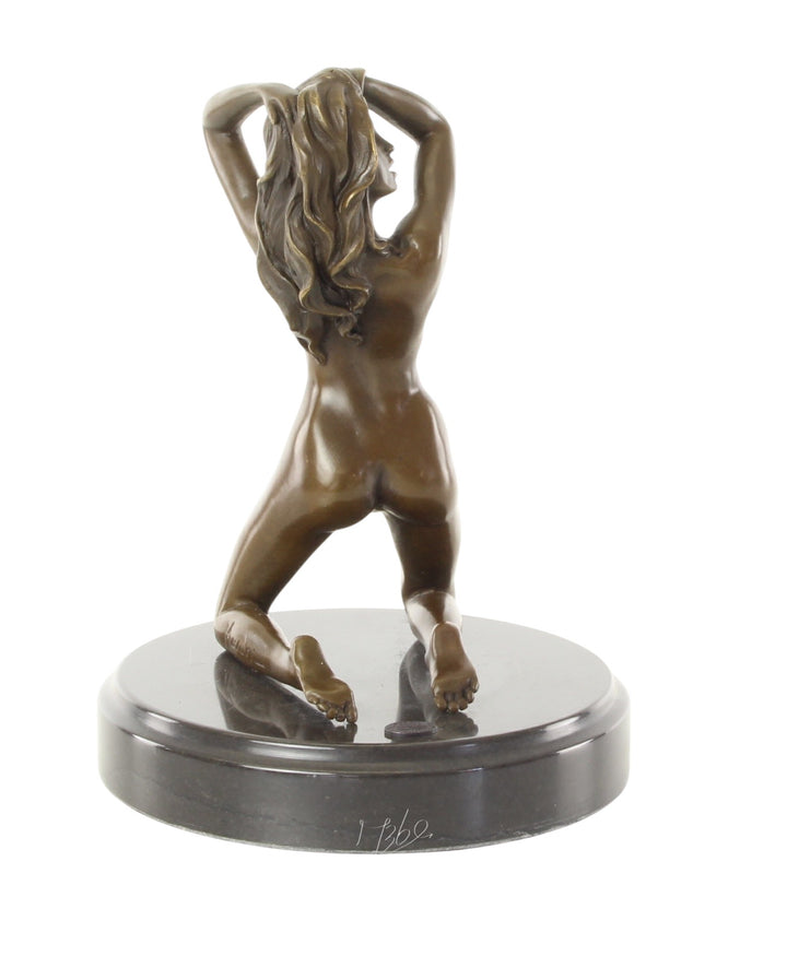 Erotic bronze sculpture of a female nude posing on her knees