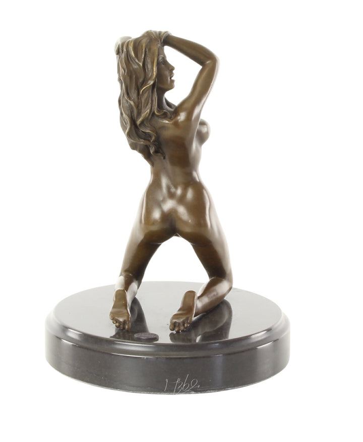 Erotic bronze sculpture of a female nude posing on her knees