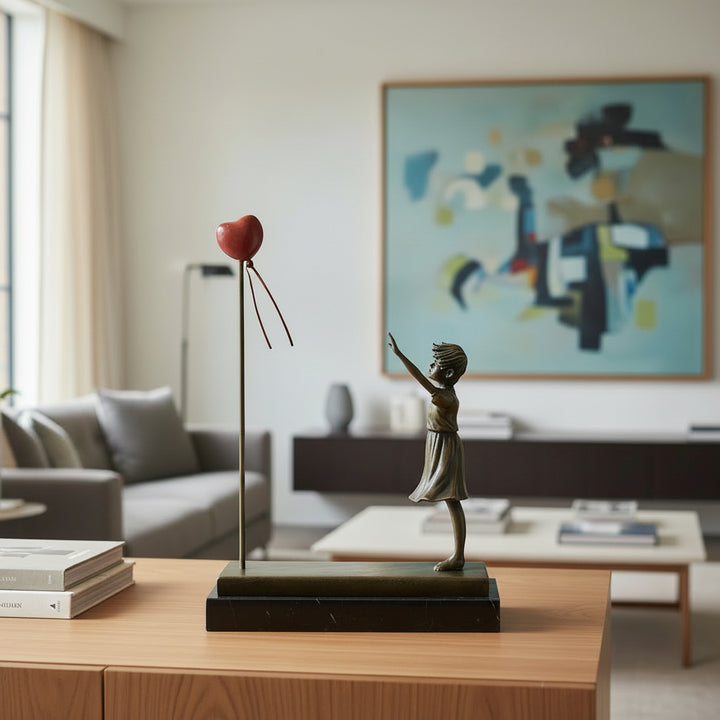 Bronze girl with balloon sculpture – inspired by Banksy