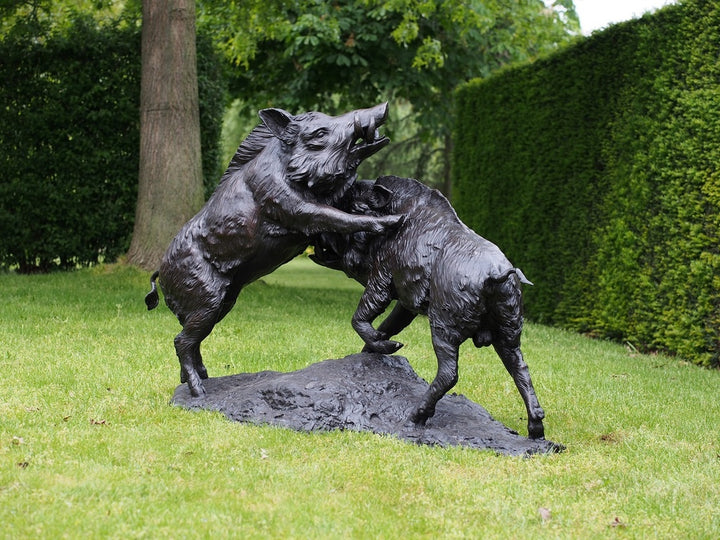 Lifesize bronze sculpture of two fighting wild boars