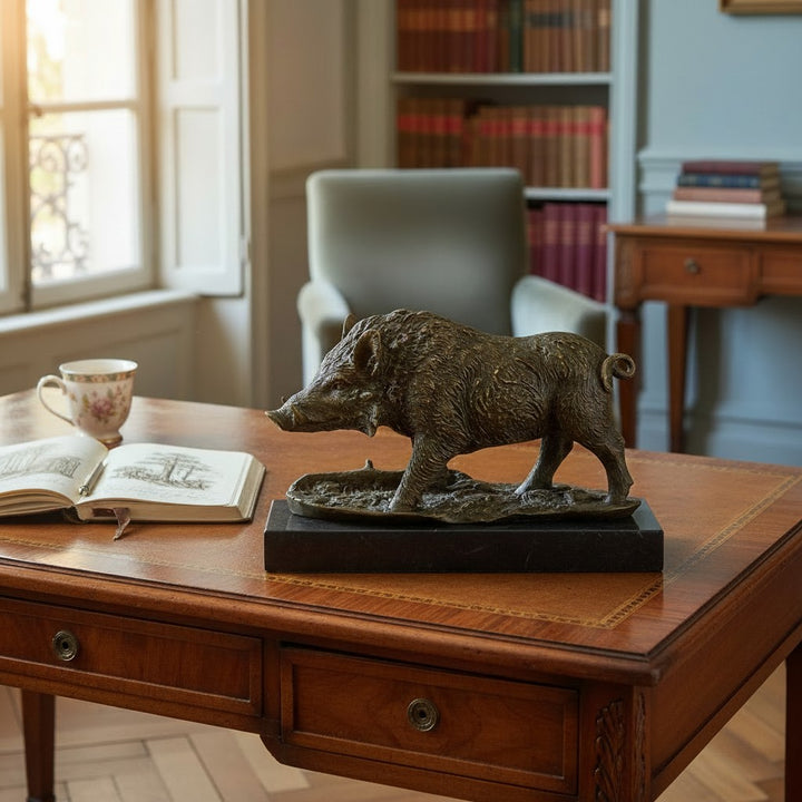 Bronze sculpture of a wild boar on a marble plateau