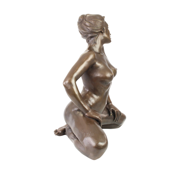 Large bronze sculpture of a kneeling female nude