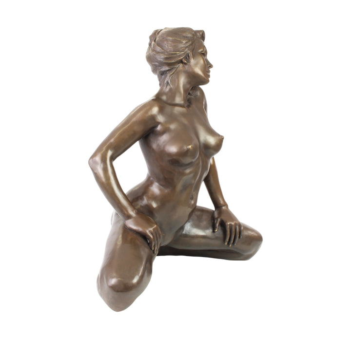 Large bronze sculpture of a kneeling female nude