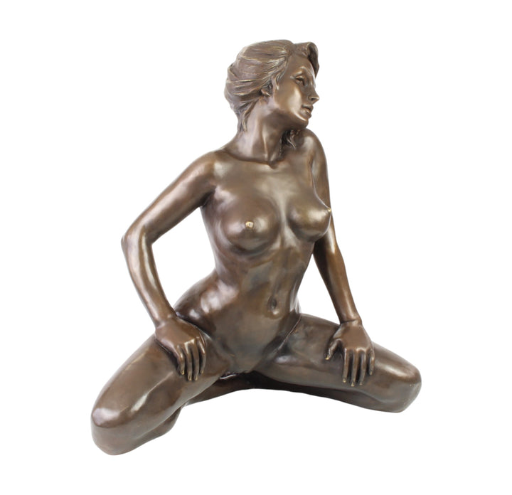 Large bronze sculpture of a kneeling female nude