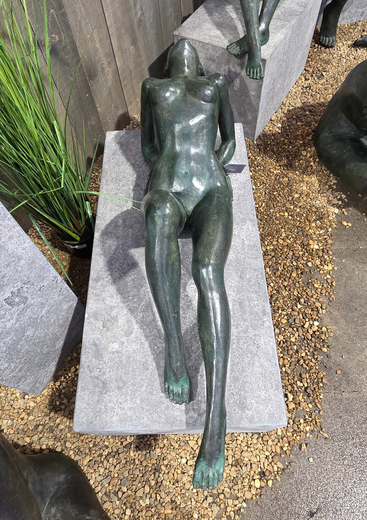 Large bronze sculpture of a reclining sensual female nude