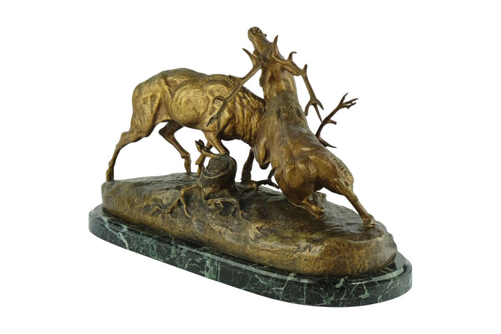 Antique bronze sculpture of two fighting stags by Charles Masson, 19th century, detailed, dramatic display of strength.