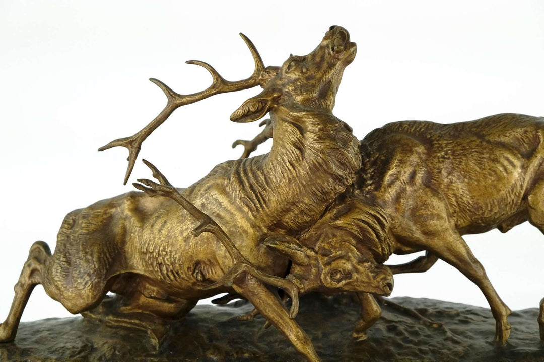 Antique bronze sculpture of two stags battling, intricately detailed by Charles Masson, 19th century, France.