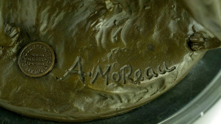 Signature 'A. Moreau' and foundry stamp on the bronze sculpture of a hunter with hounds.