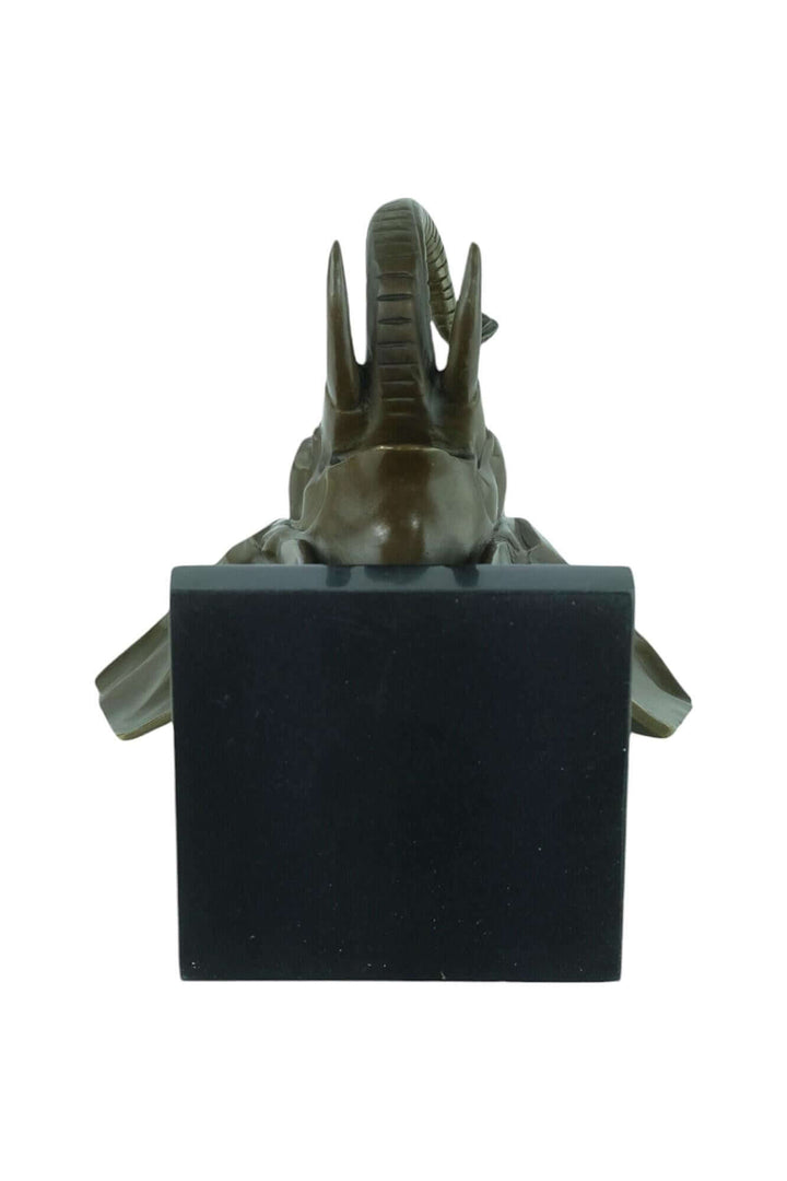 Bronze Art Deco elephant head sculpture on a marble base, intricate design with raised trunk and tusks.